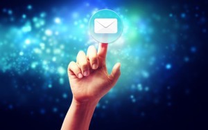 Hand pressing a envelope icon over technology blue background