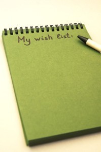 Hand drawing wish list on notebook from recycling paper on grey background with handle